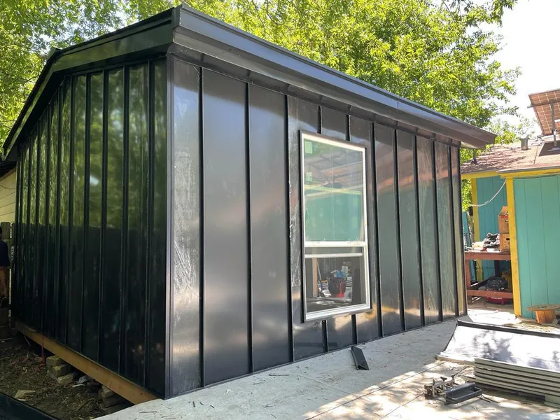 Black standing seam metal wall panels for Metal Roof Installation in Potsdam