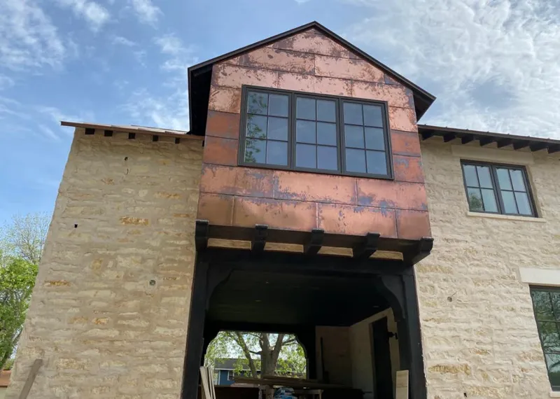 Copper metal panel facade on a stone building for Metal Roof Coating in Potsdam